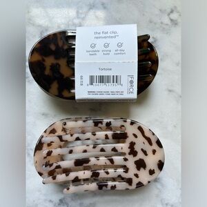 Teleties MED flat hair clip. New. Never been used.  Two clips.  One has tags.